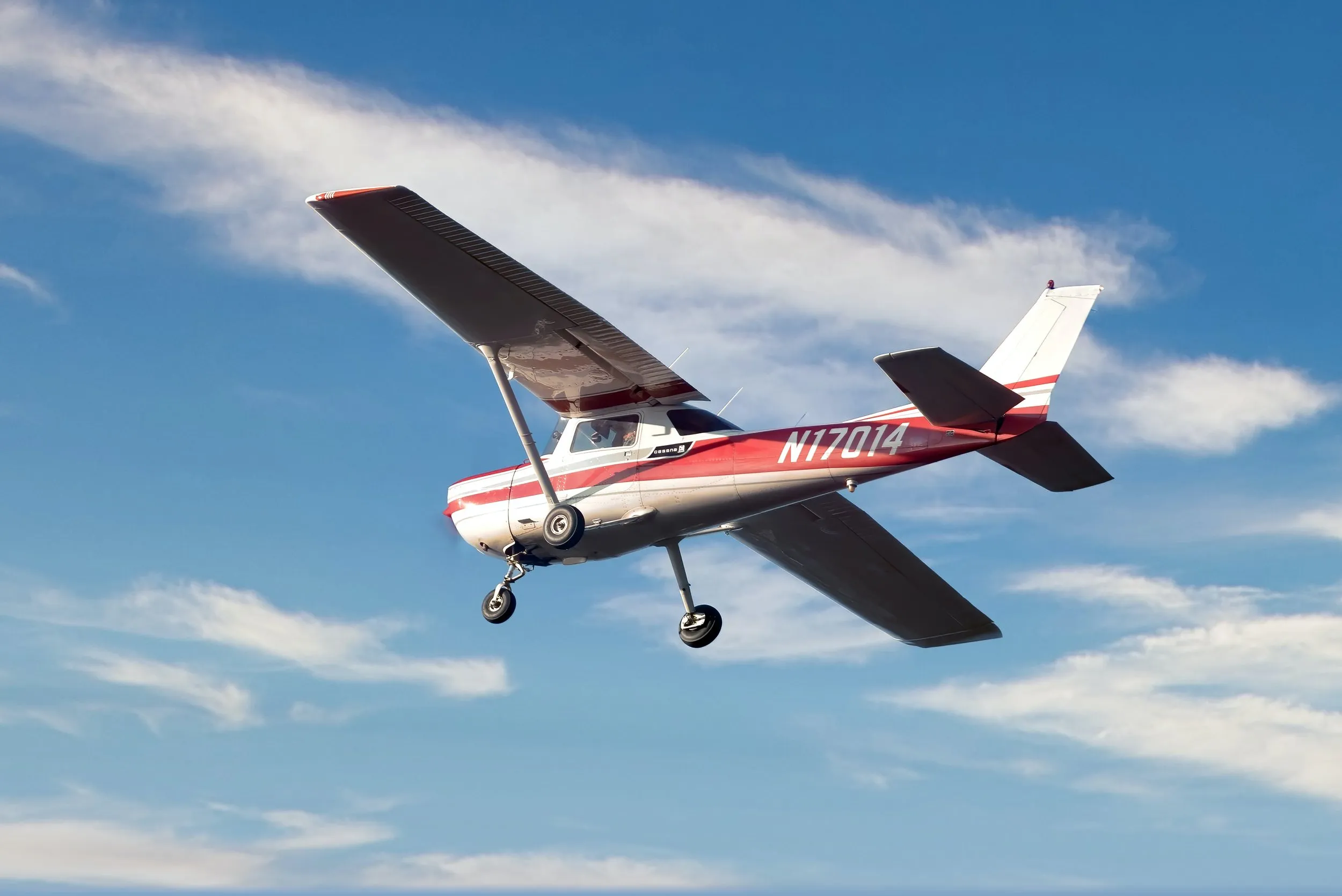 Sharon next to a Cessna 152